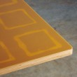 Particolare tavolo 120X120 cm. Struttura in ferro e paino in multistrato rivestito in resina.